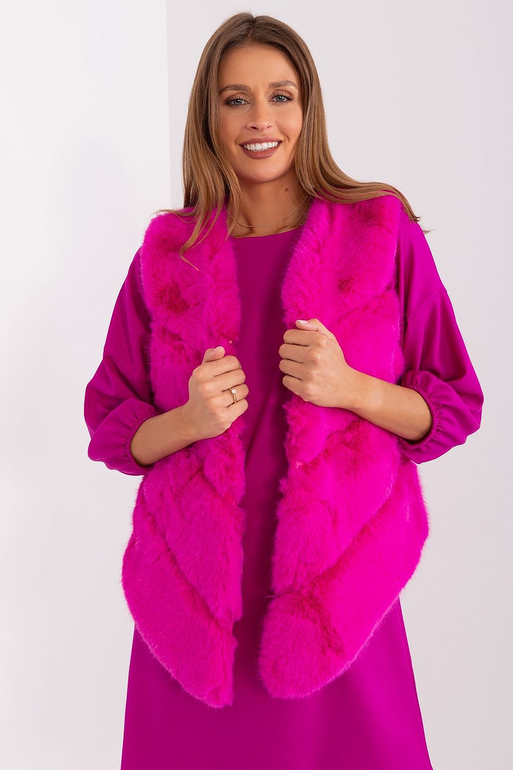 Women's rich pink faux fur gilet with practical pockets