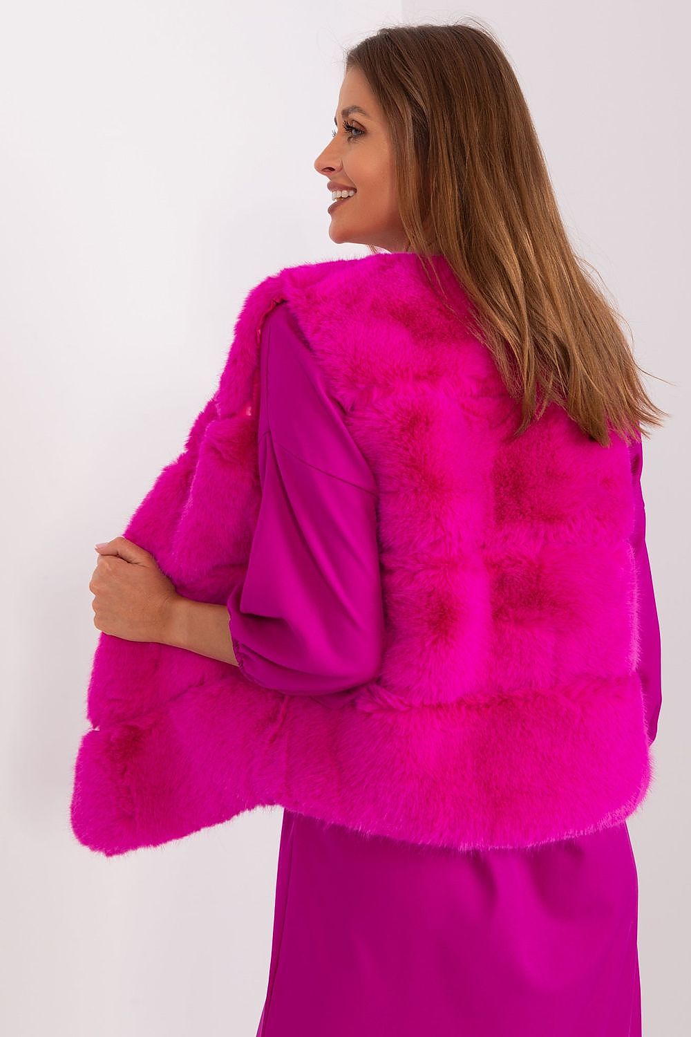  Women's rich pink faux fur gilet with practical pockets rear view