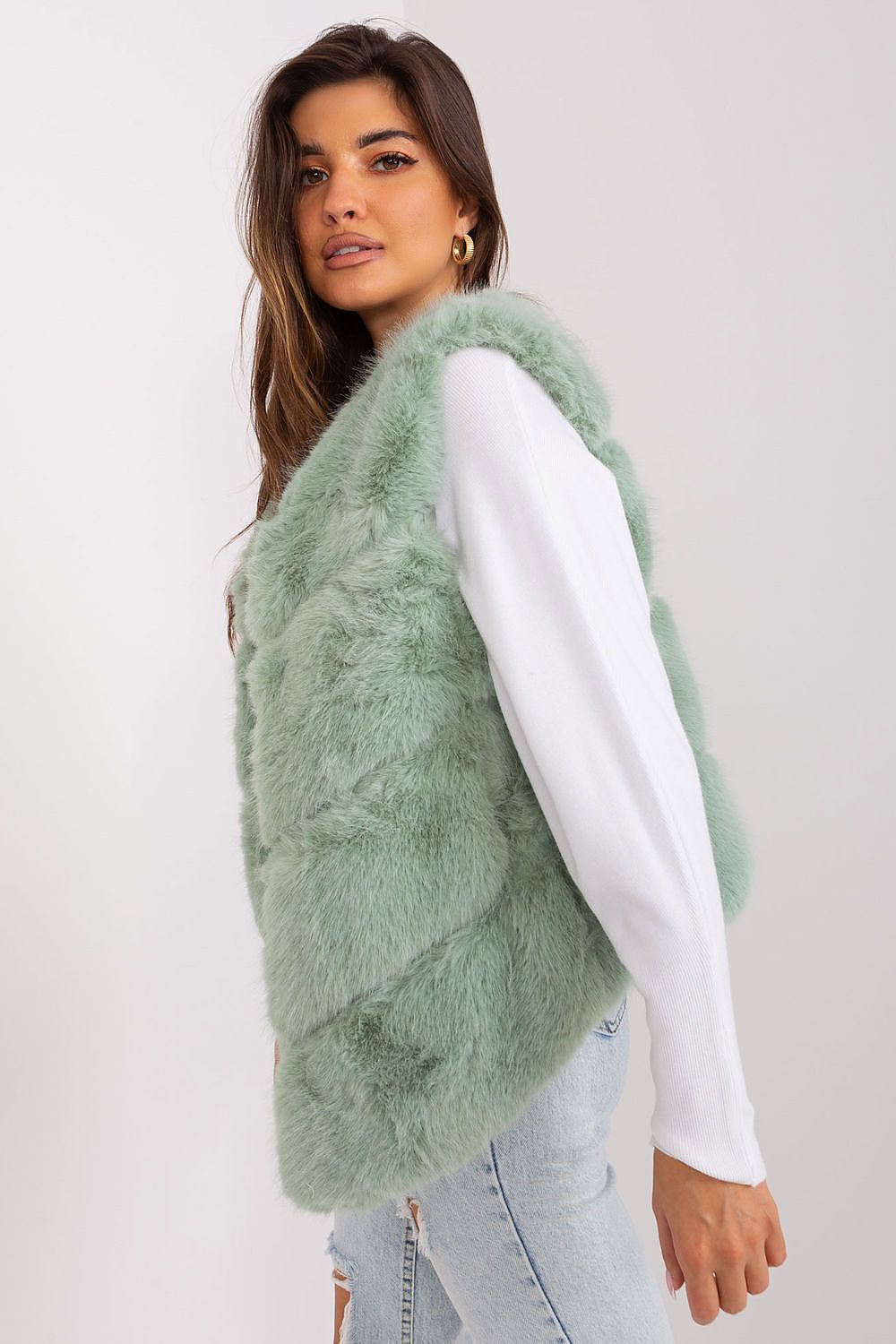 Women's green faux fur gilet with practical pockets-side view