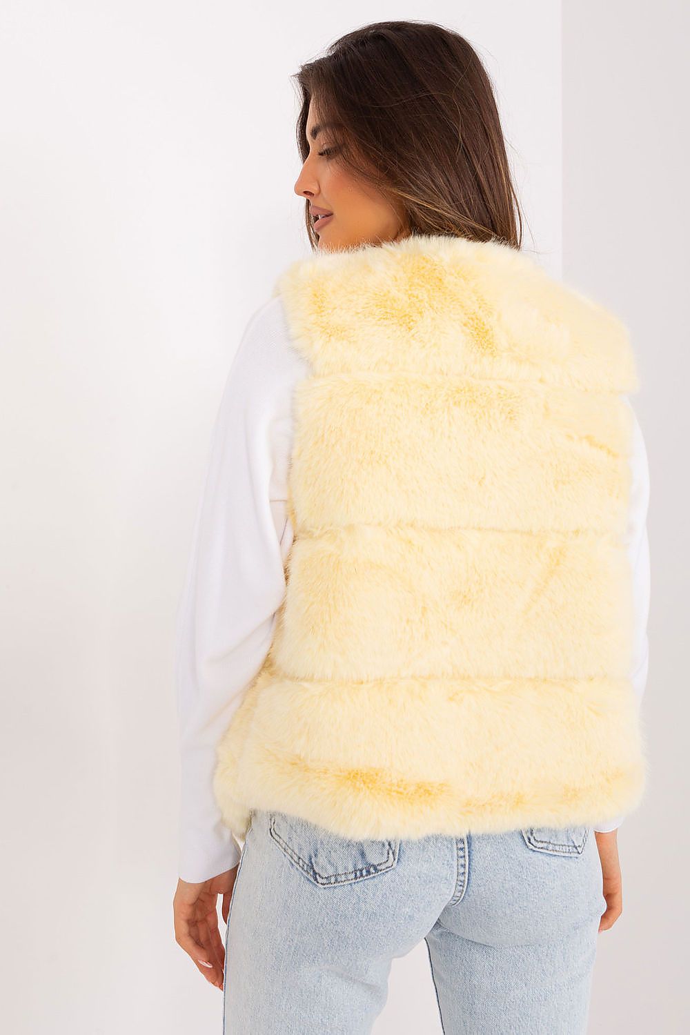 Women's yellow faux fur gilet with practical pockets rear view