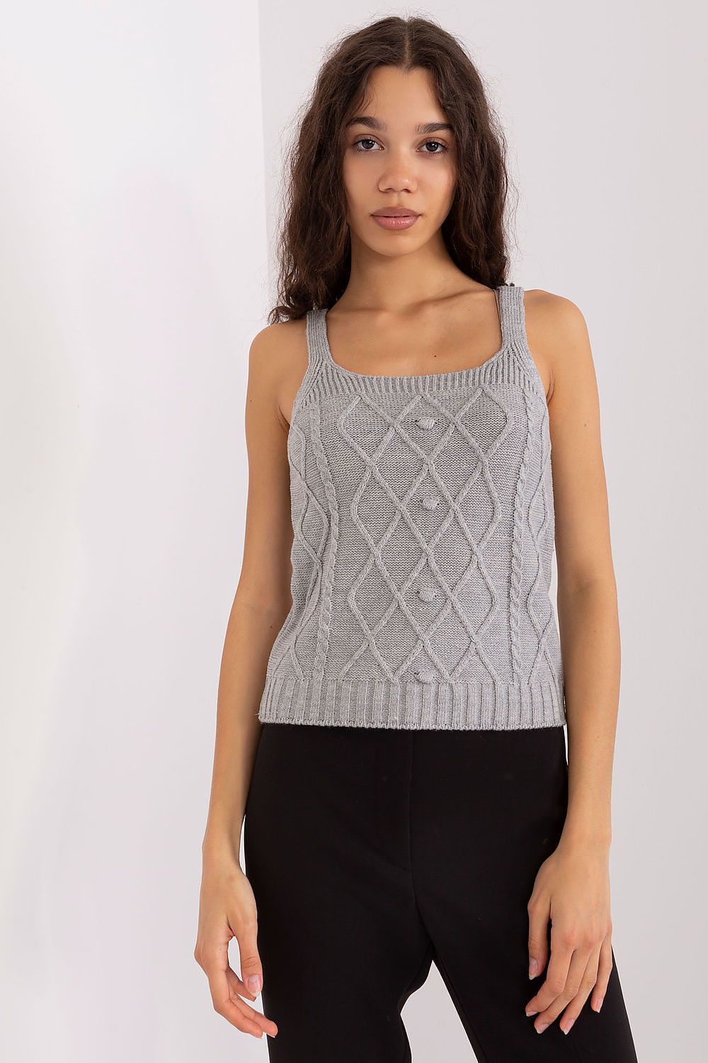 Close-up of textured fabric and sleeve detail in grey