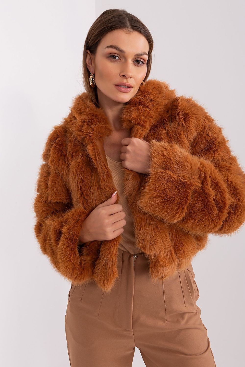 Women's brown hooded faux fur jacket with long sleeves and short modern fit