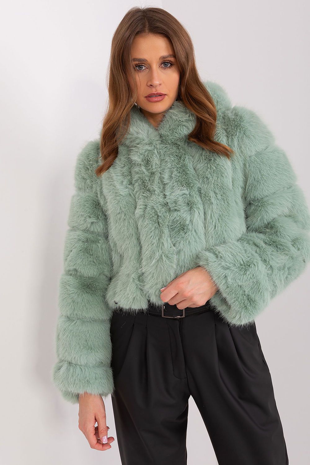 Green faux fur hooded jacket styled for an elegant casual outfit