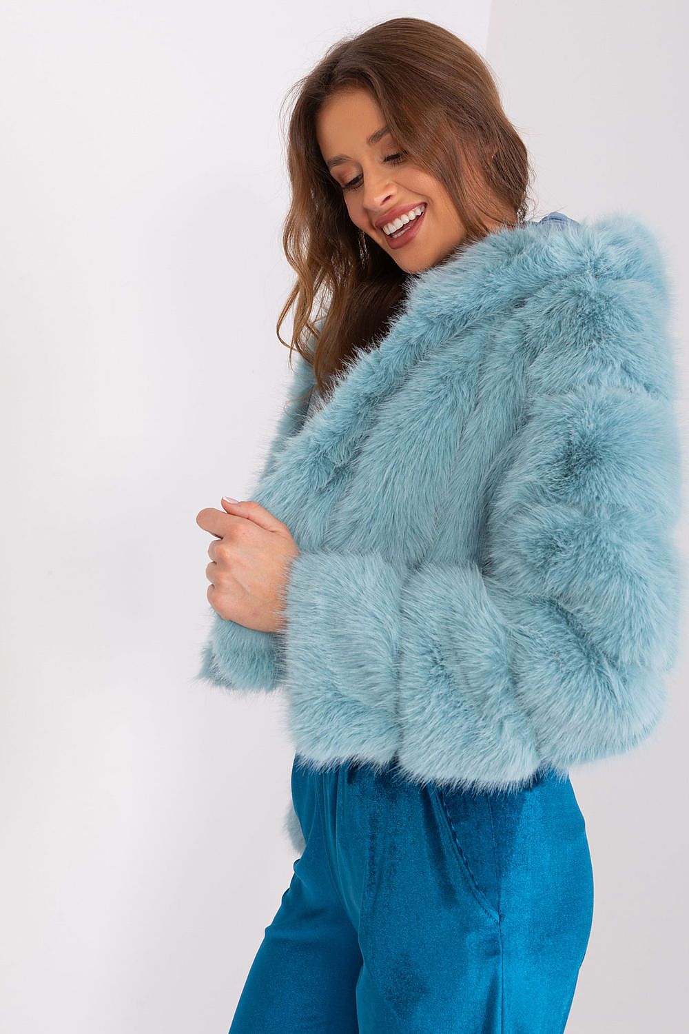 Women's lightweight green faux fur jacket with lined interior and easy fastening-side view