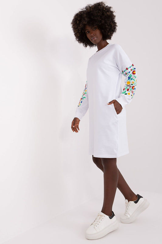 “White Pattern Sleeve Sweat Dress, front view showing pockets”