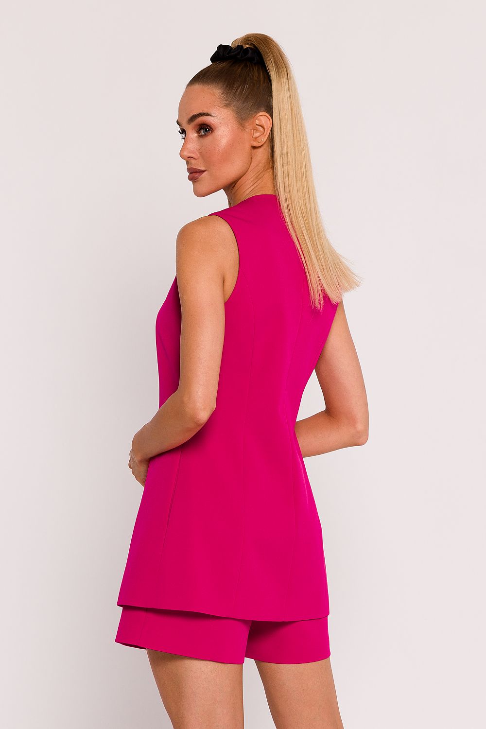  pink tailored vest with deep v neckline and single button