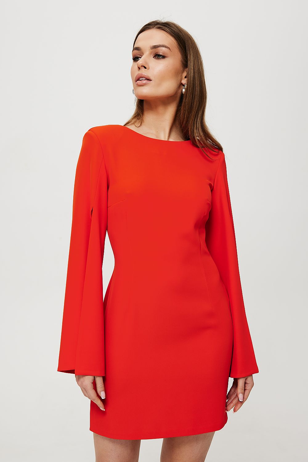 Woman wearing a red dress against a white background