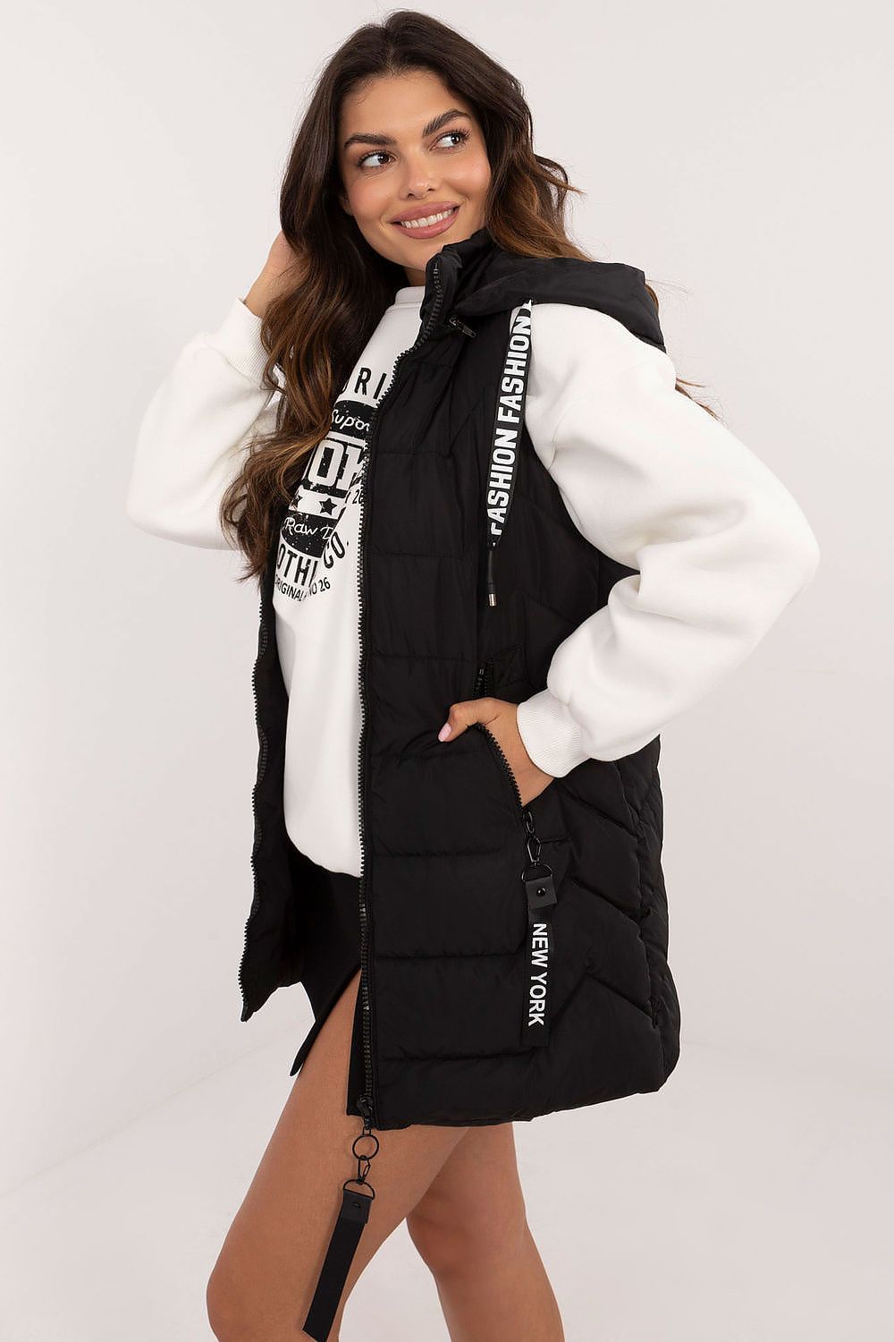  Women's black quilted longline gilet with hood and zip fastening.