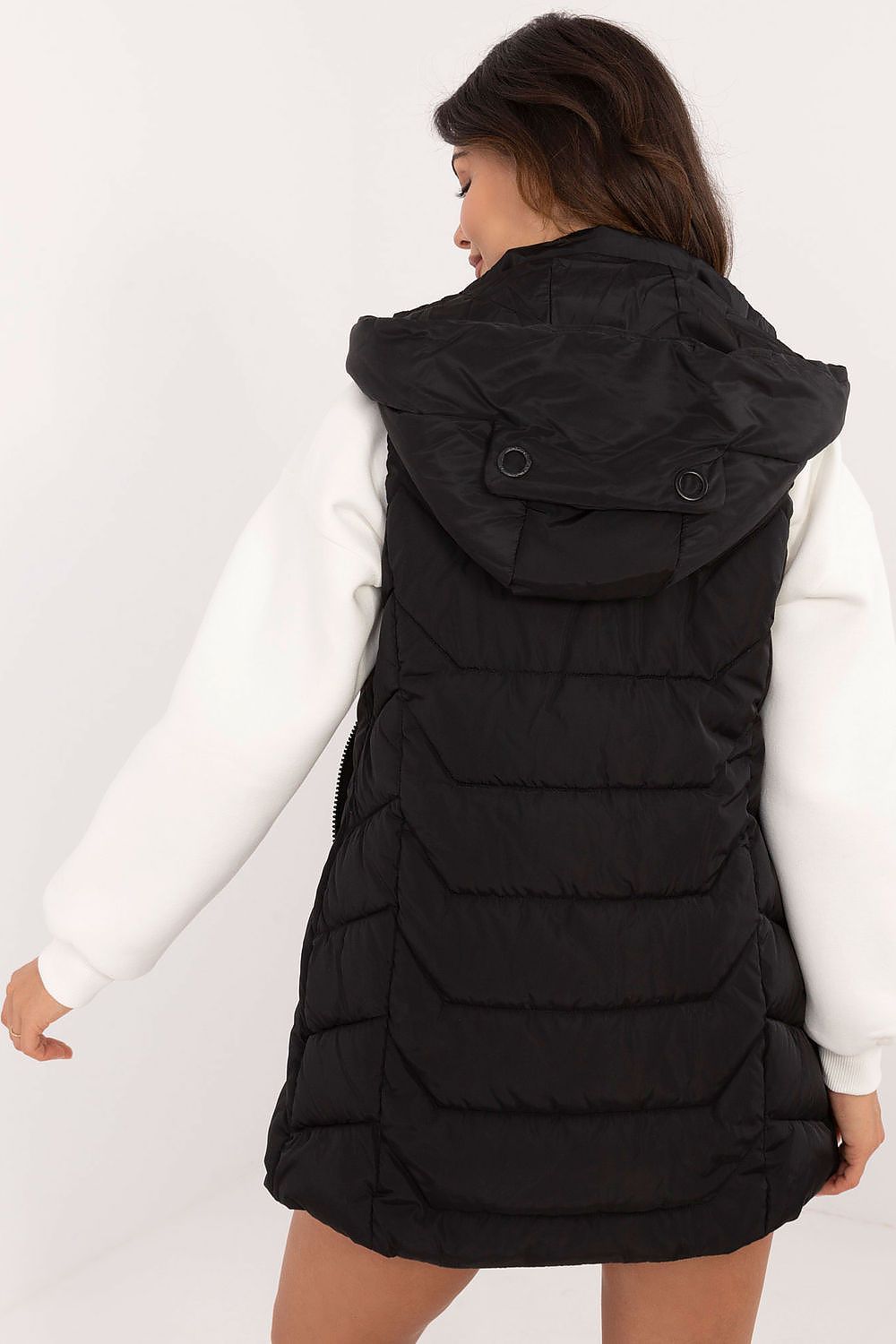 Women's black quilted longline gilet with hood and zip fastening. 2