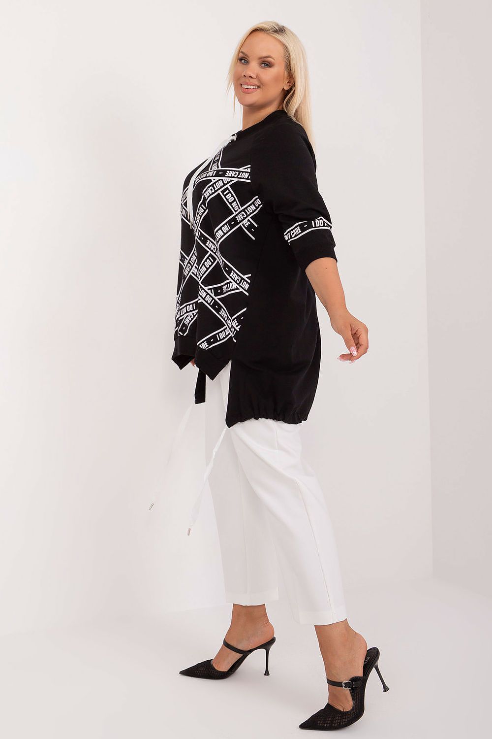  Side angle of black top highlighting extended silhouette