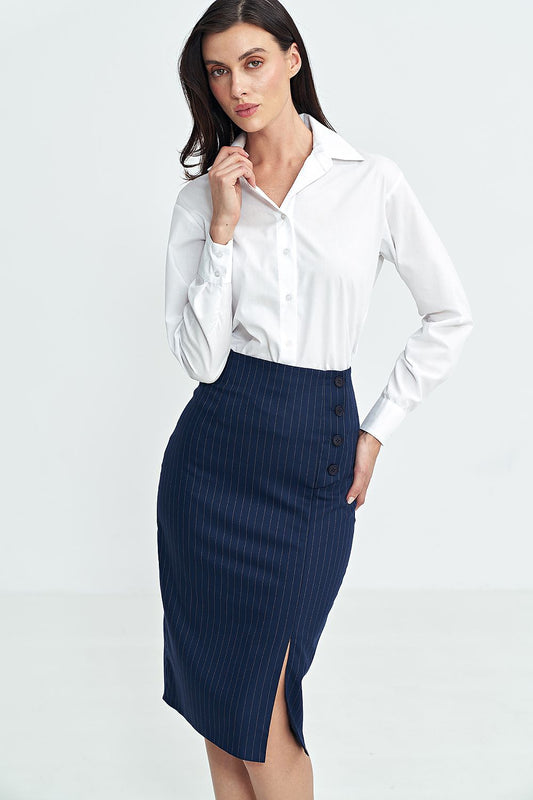 Woman wearing a white blouse and navy skirt on a white background