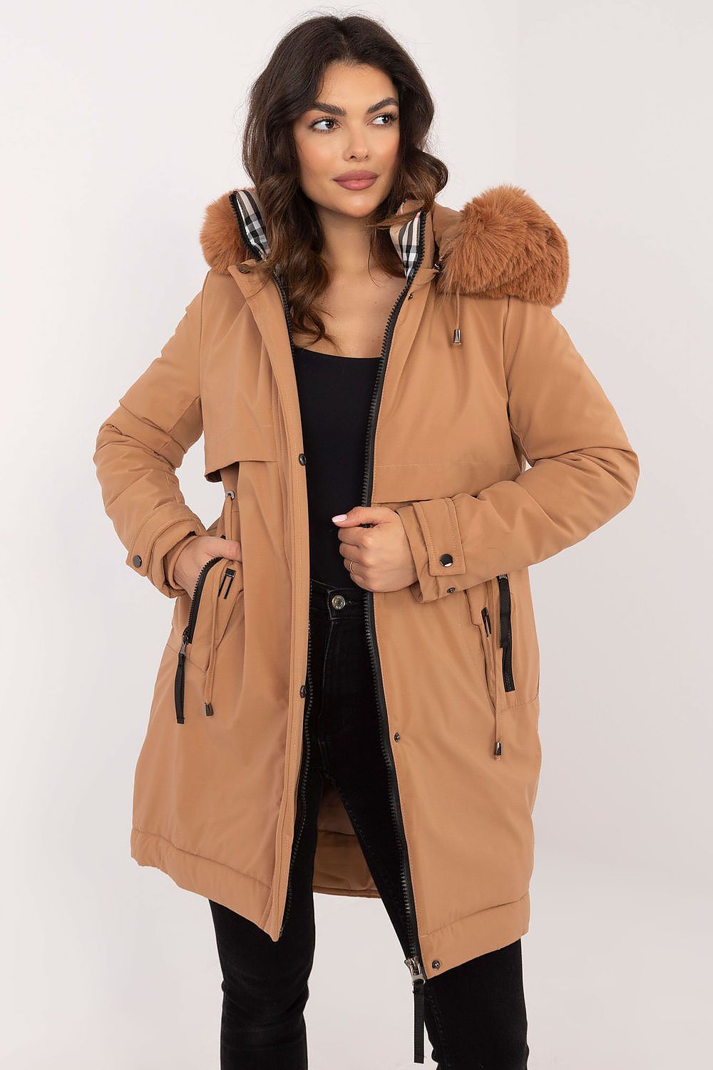  Detailed view of brown jacket’s texture and fur hood.