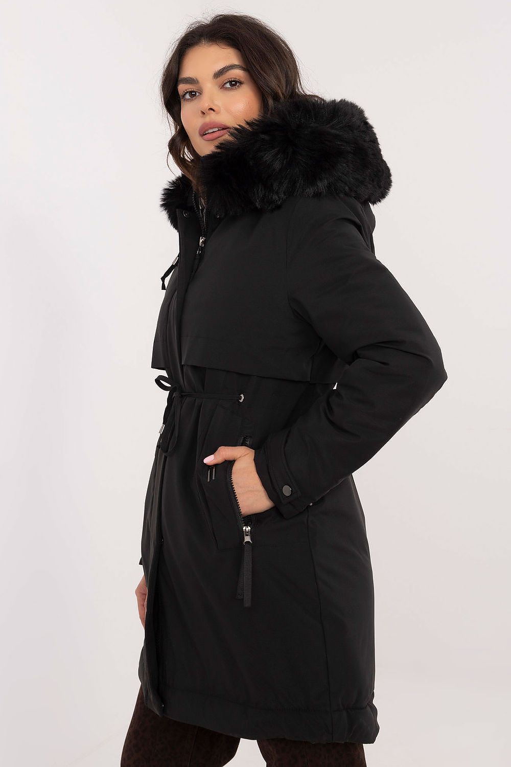  Model in black belted jacket for cold weather.