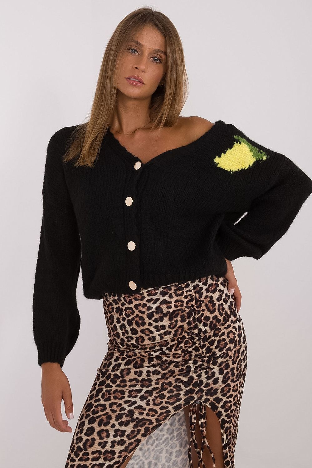Front view of black casual buttoned sweater with subtle chest print.