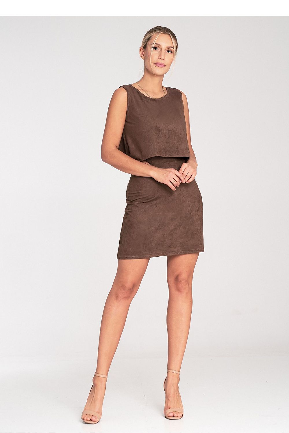 Woman wearing a brown dress on a white background