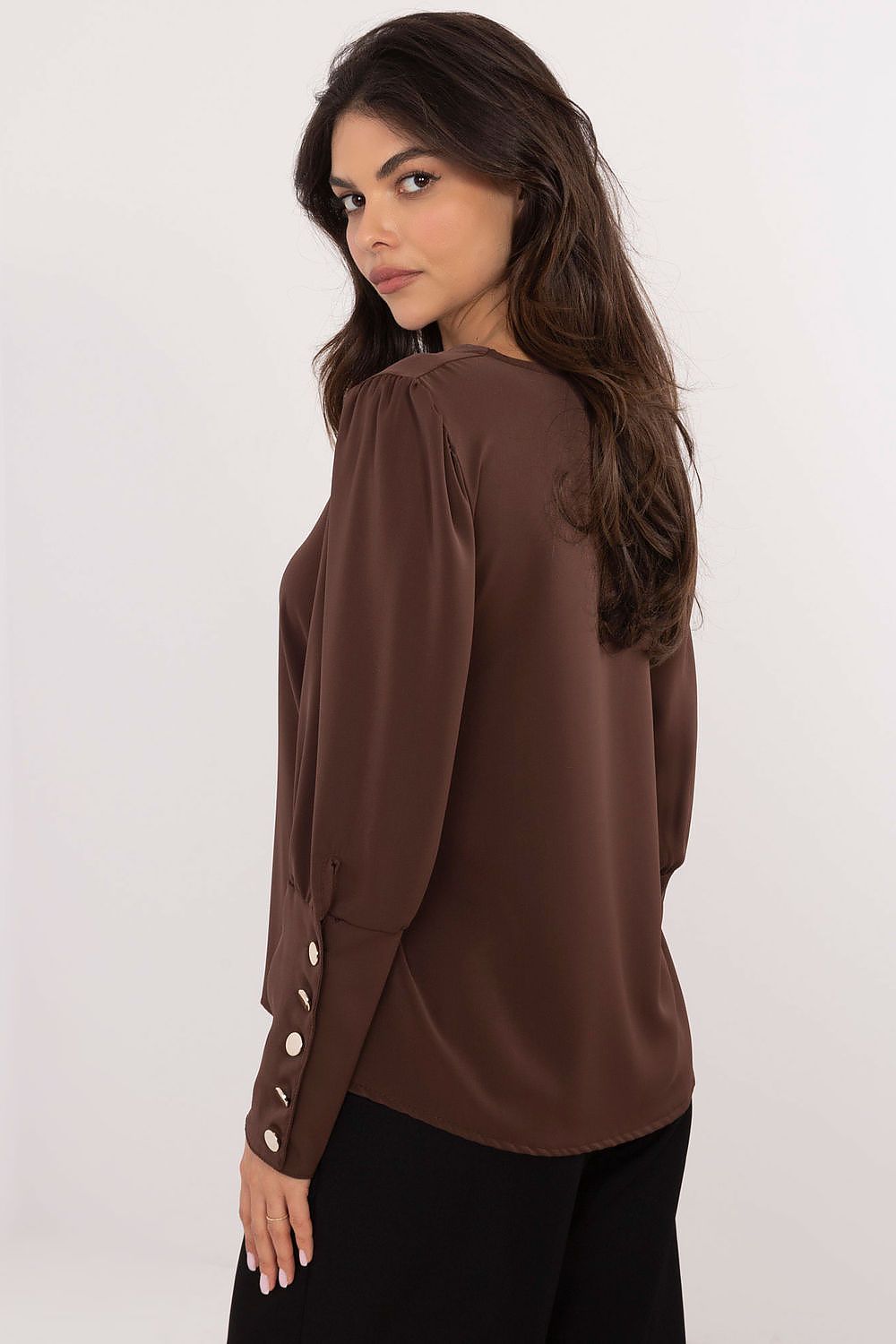 Back view of brown blouse with tailored fit and smooth finish.