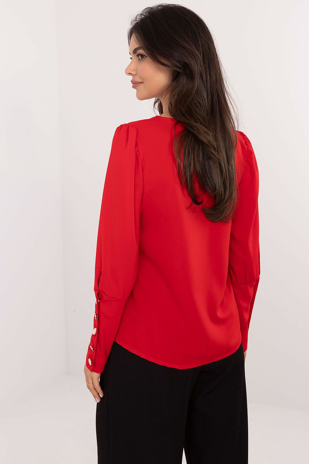 Back view of red blouse highlighting standard length and refined design.