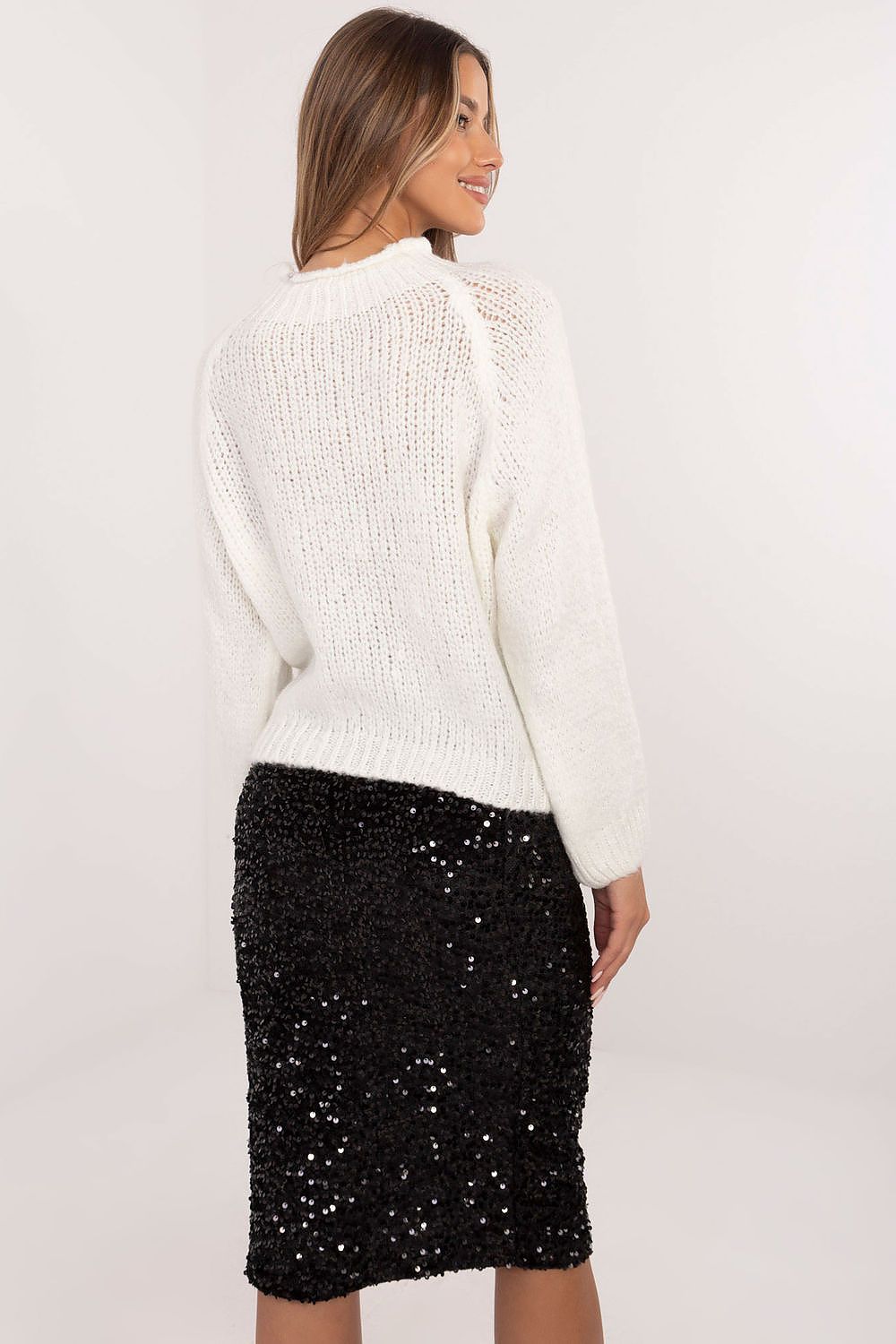 Back view of versatile women’s casual sweater in smooth knit pattern. Beige