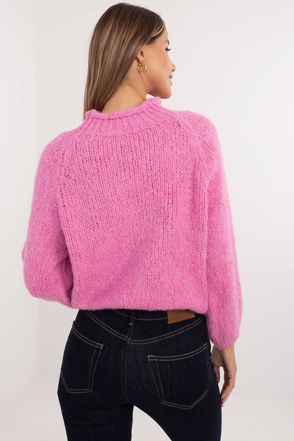 Back view pink versatile women’s casual sweater in smooth knit pattern.