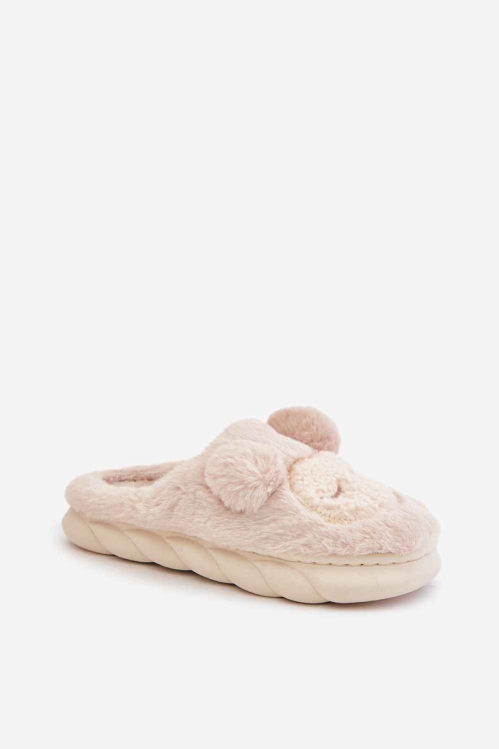 Beige slipper with fuzzy texture on a white background