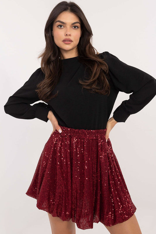  Close-up of sequin bomb mini skirt showcasing shimmering fabric and modern design.