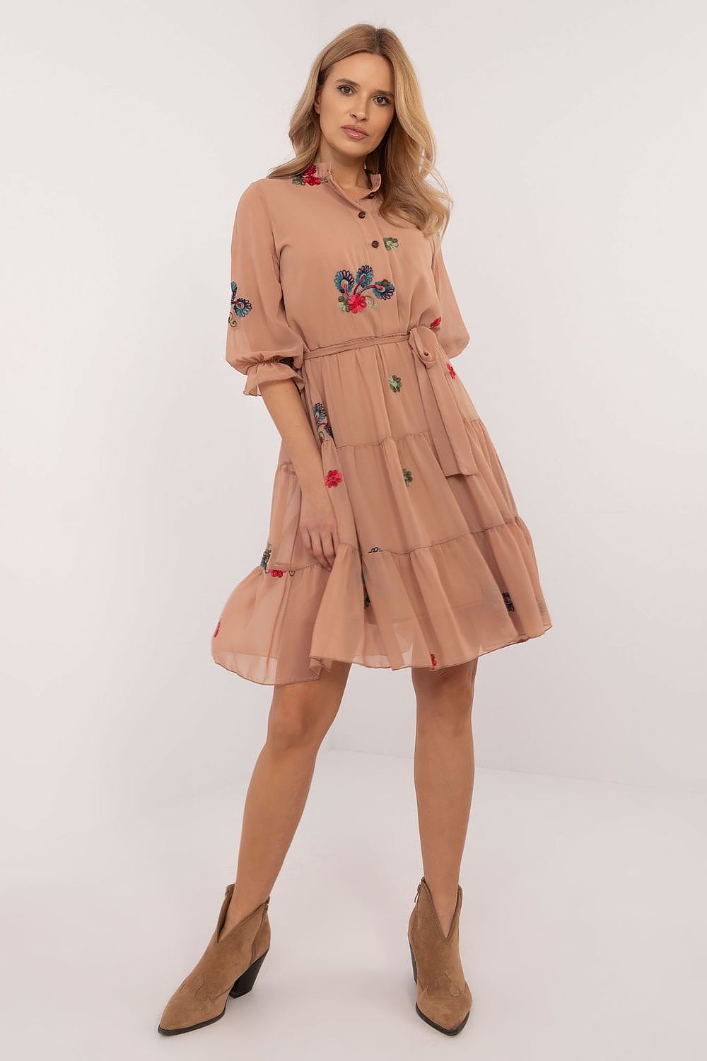 The Florence Embroidered Midi Dress in beige featuring elegant embroidery and a flattering flared silhouette