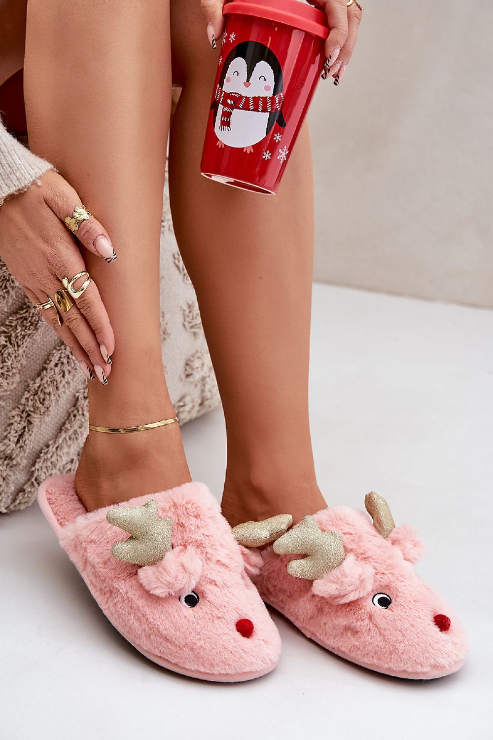  Pink cozy fur slippers with festive reindeer design