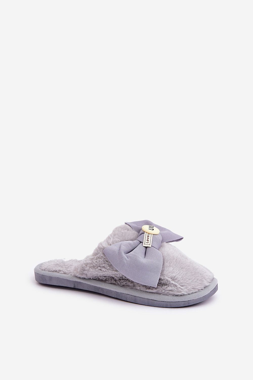 Gray slipper with a bow on a white background
