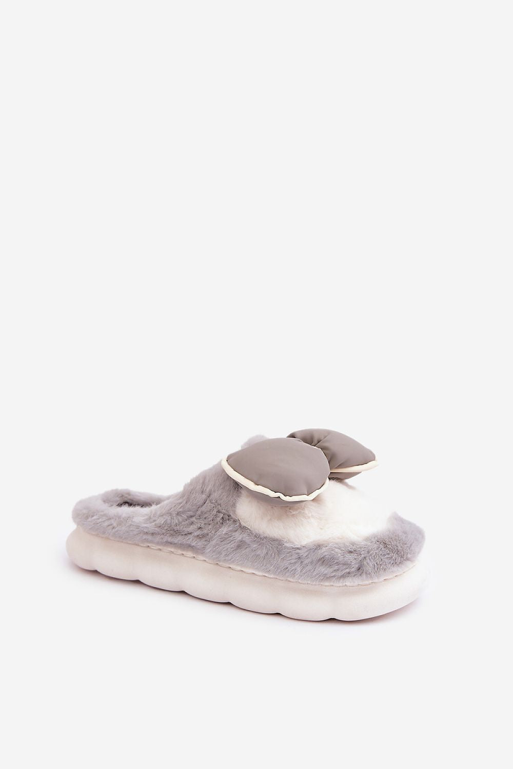 Gray fuzzy slippers with a heart design on a white background