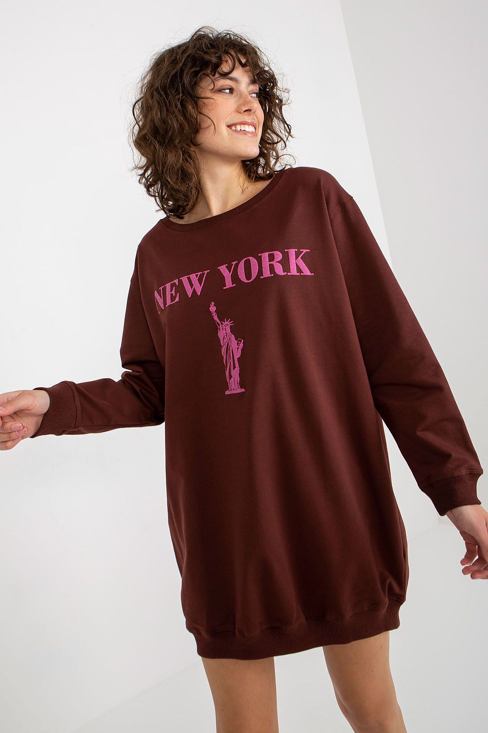Brown sweatshirt with 'New York' and Statue of Liberty graphic on a white background