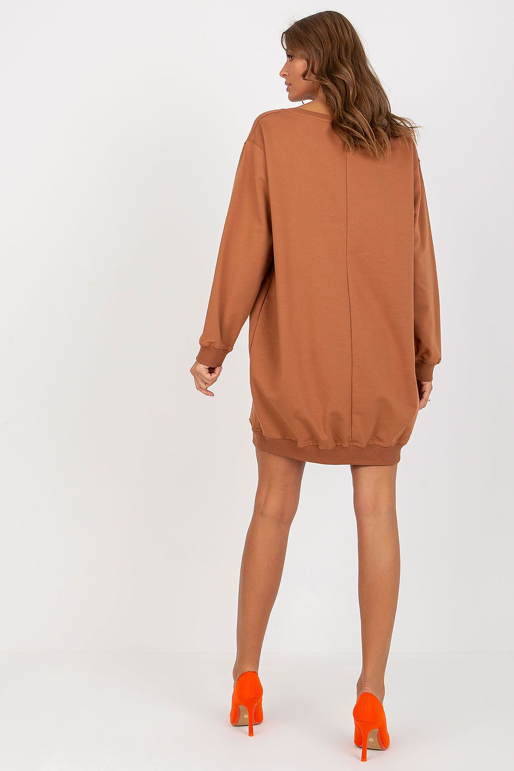 Brown sweatshirt dress worn by a model on a white background