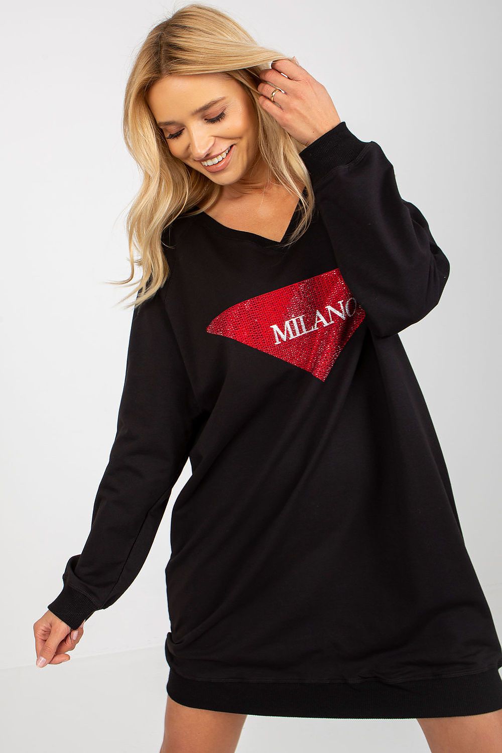 Black dress with red sequin triangle design on a plain background