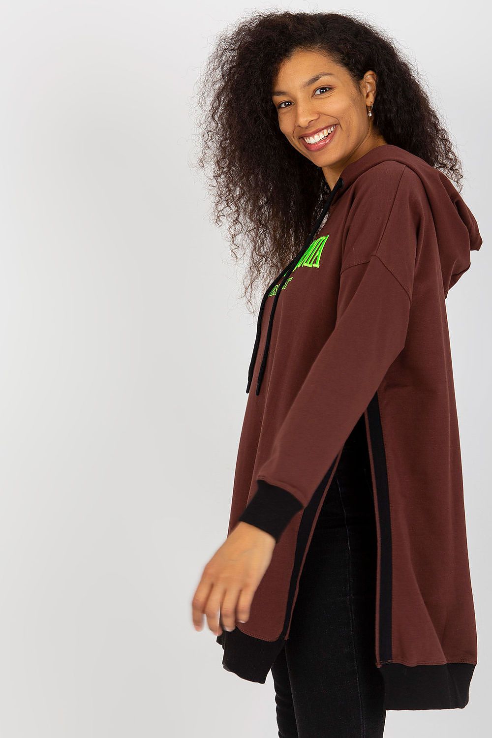 Woman wearing a brown hoodie with a logo on a white background