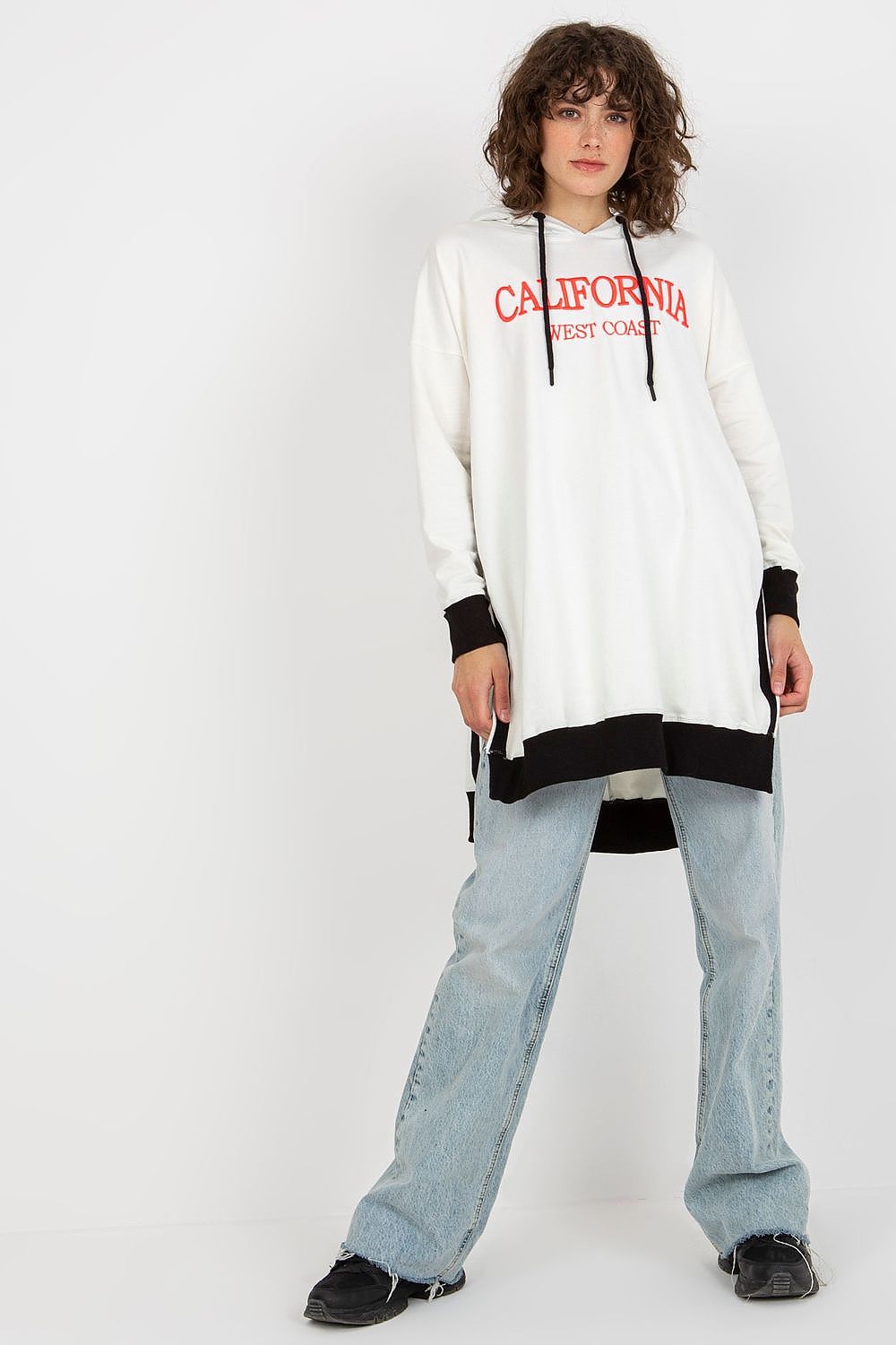 Person wearing a white hoodie with red text on a plain background