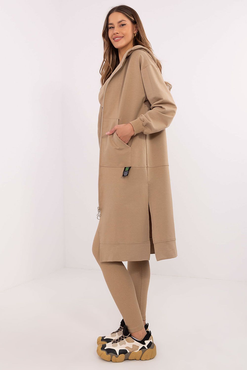  Women’s beige 3-piece set featuring long hoodie, fitted top, and leggings.