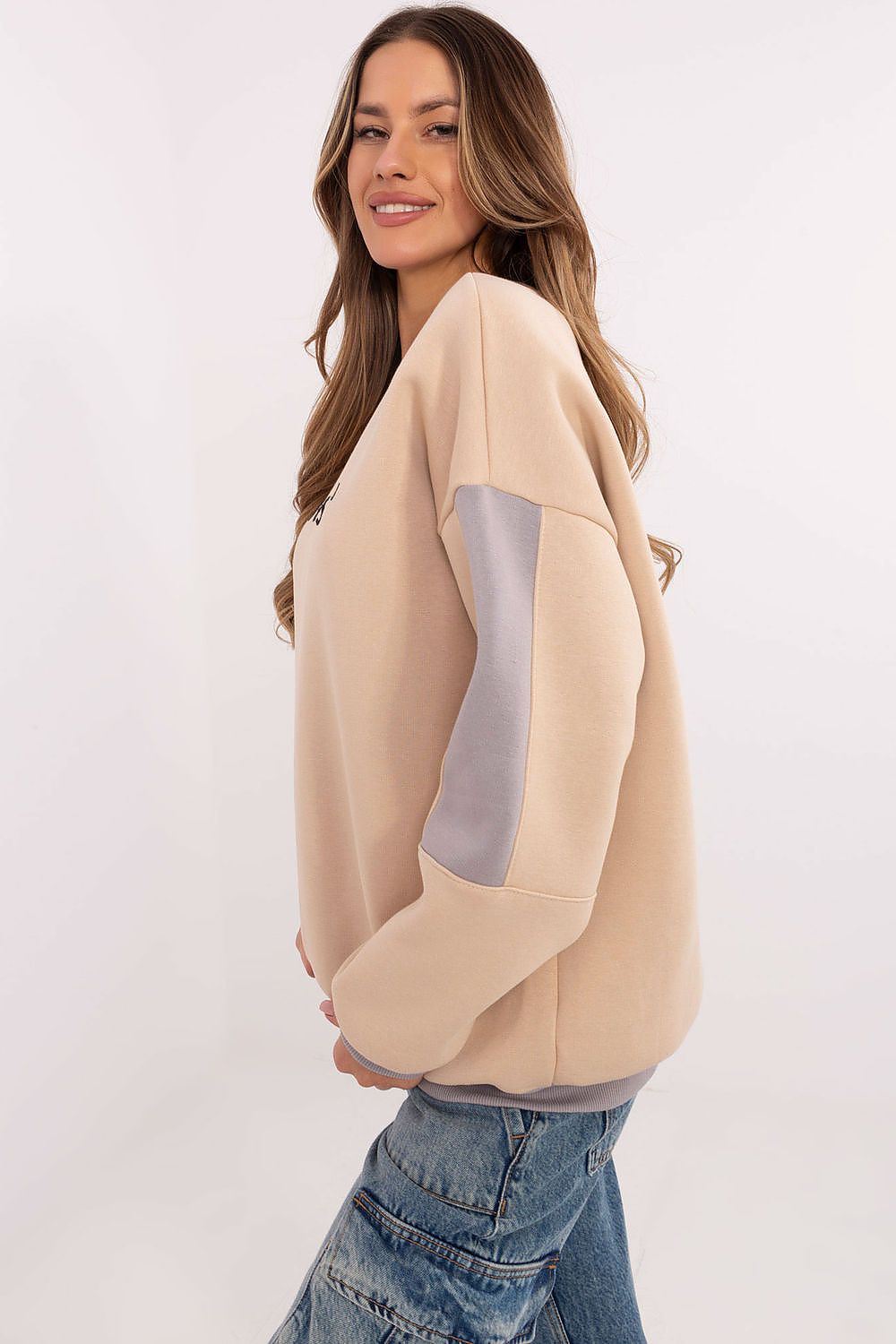 Soft beige cotton blend pullover sweatshirt with long sleeves.