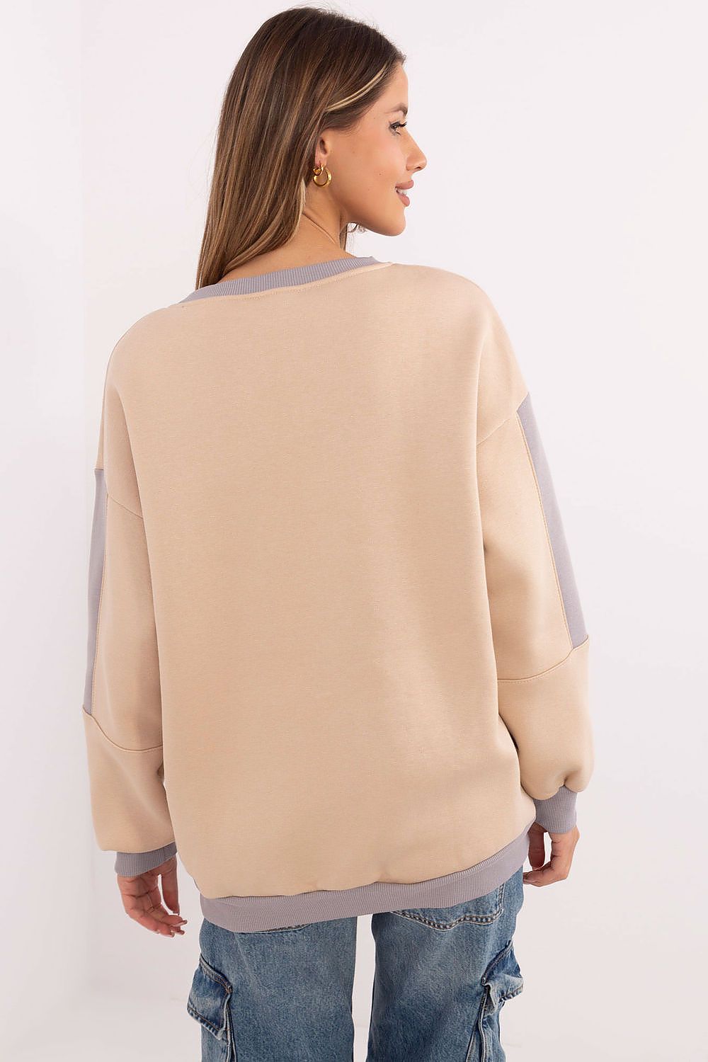 Beige insulated sweatshirt with decorative patches, casual style.
