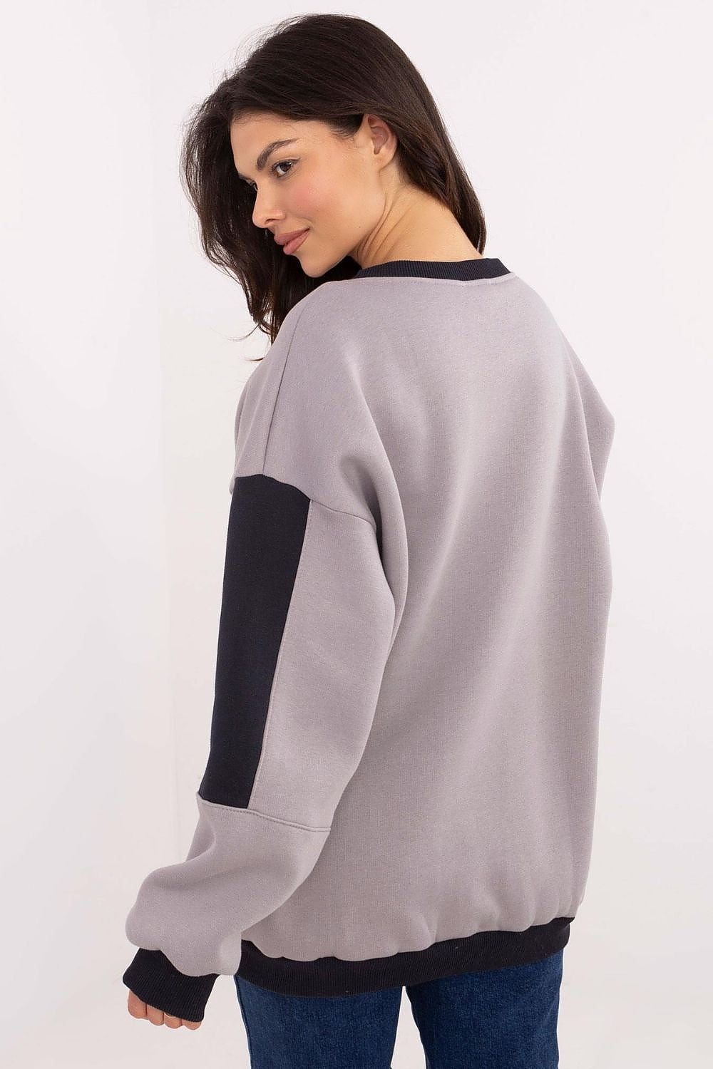 Warm grey pullover sweatshirt, front view on model.