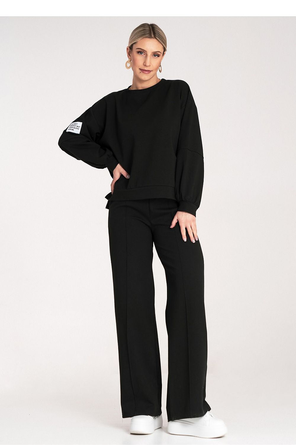  Women's black wide-leg tracksuit set styled for relaxed everyday wear