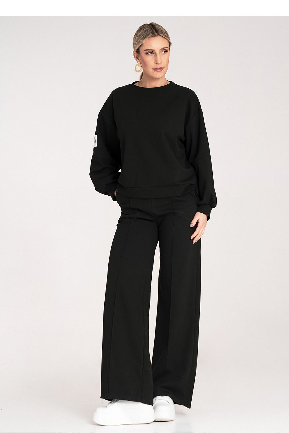  Women's black wide-leg tracksuit set styled for relaxed everyday wear-2