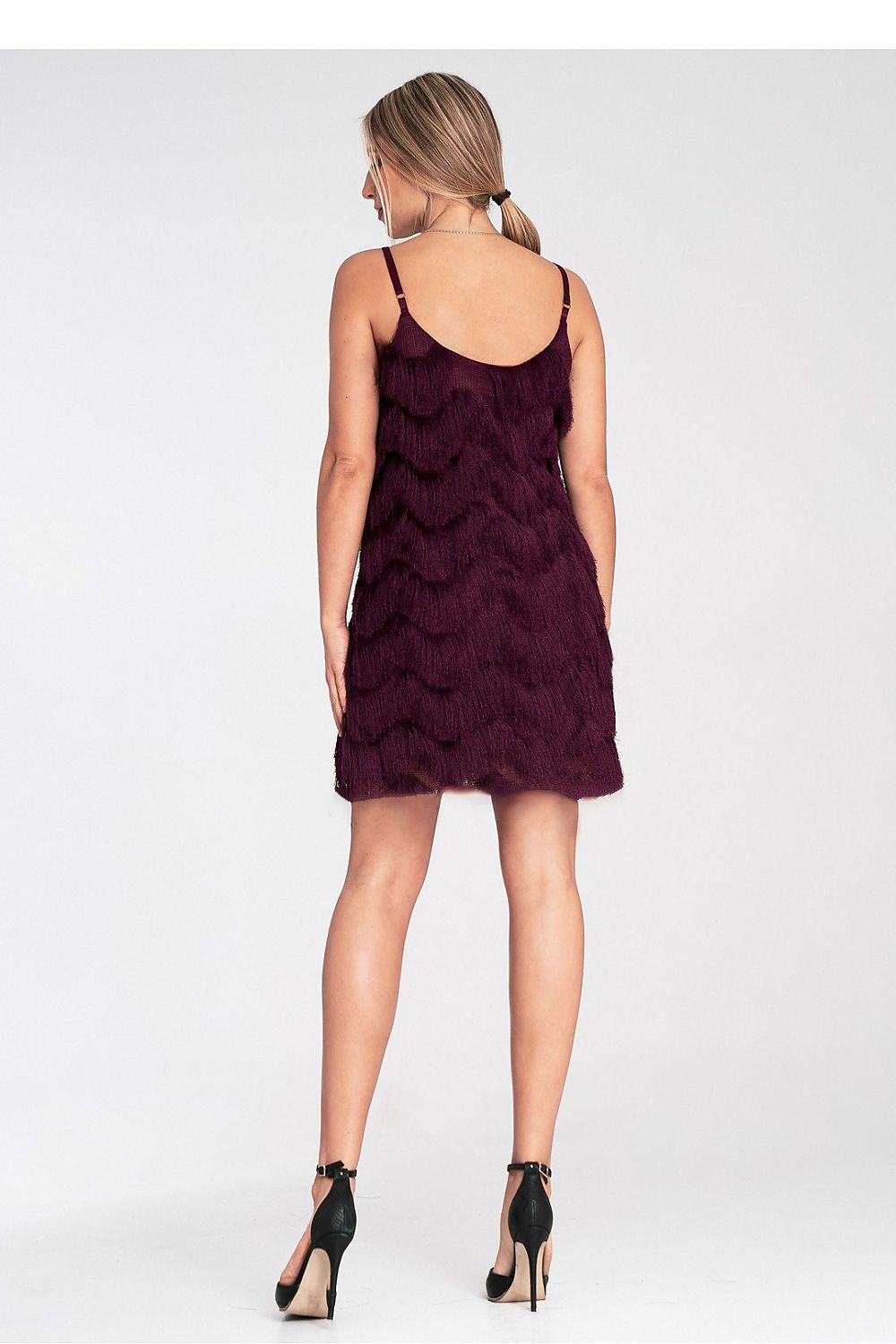 Woman wearing a purple dress on a white background