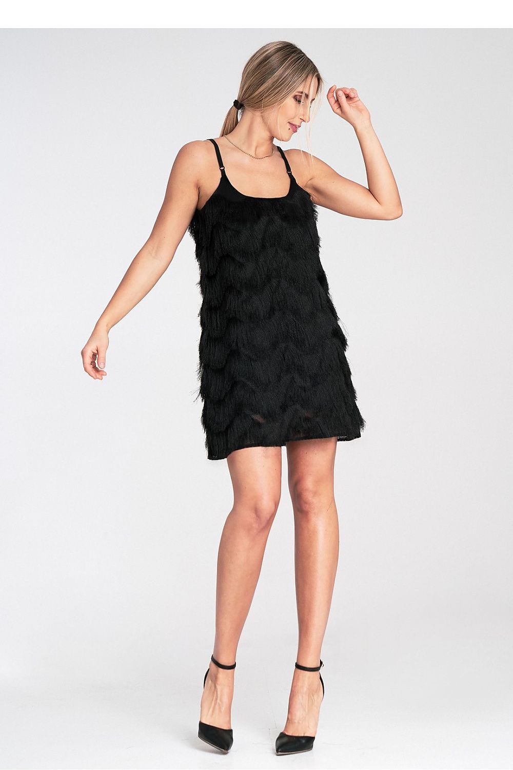 Woman wearing a black dress on a white background