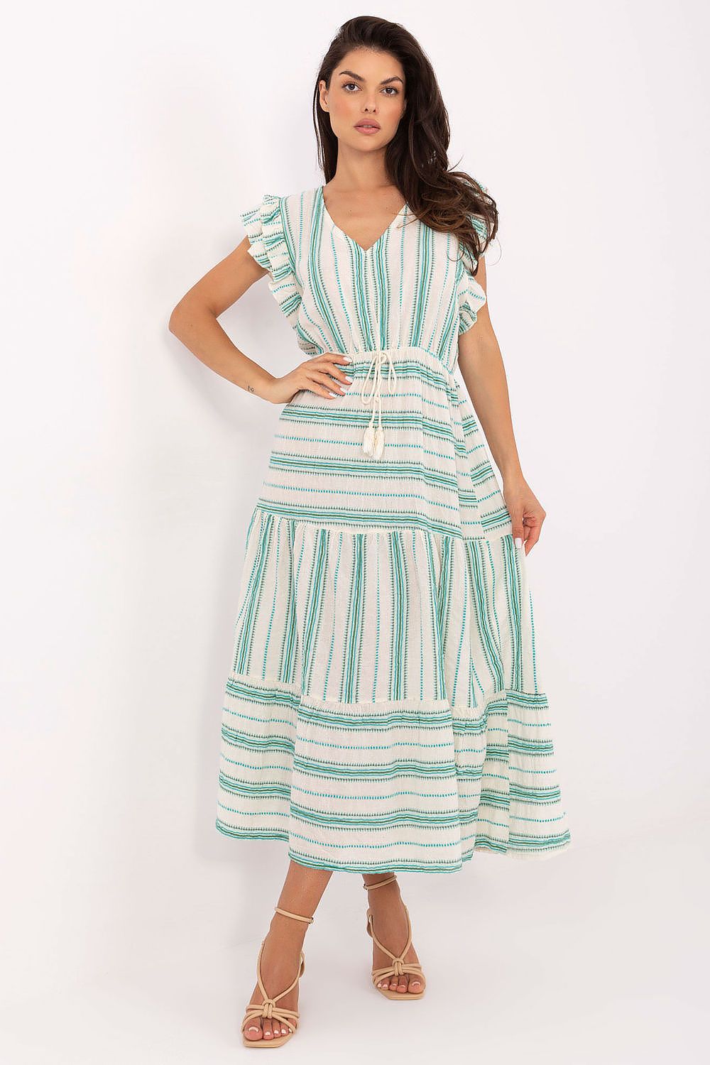 Woman wearing a green and white striped dress on a white background