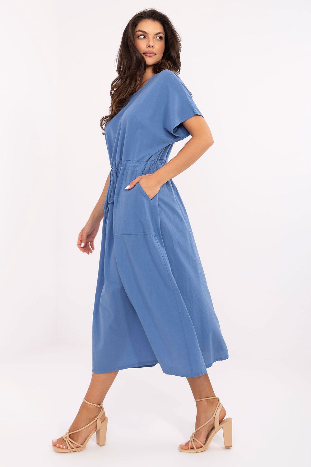 Woman wearing a blue dress on a white background
