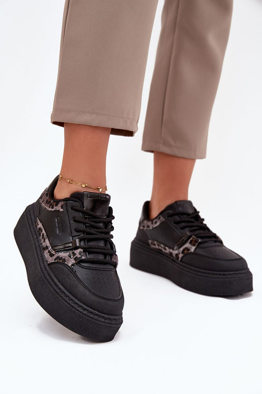 Side view – Black women’s platform sneakers showing sleek silhouette.