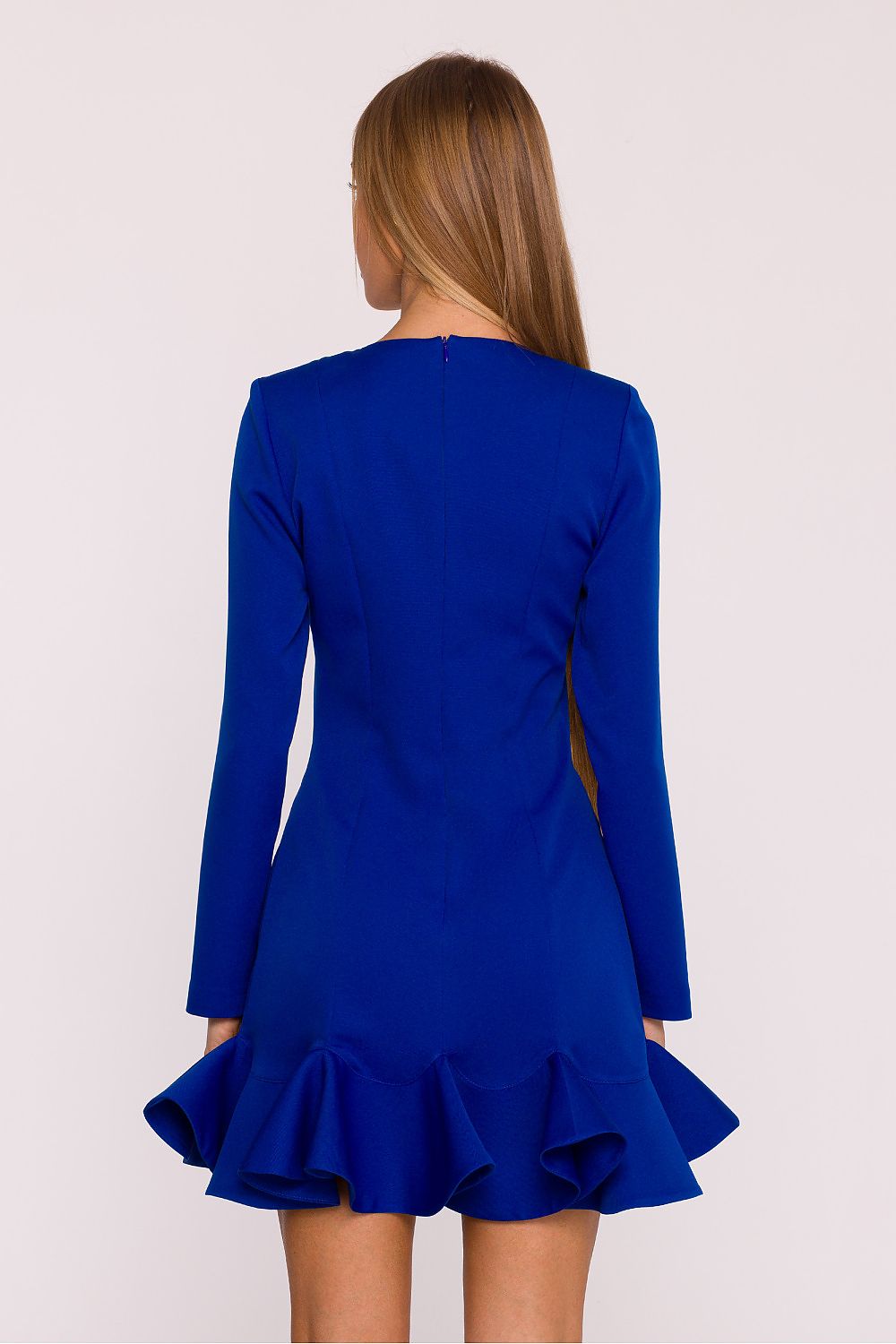 Blue dress with long sleeves and ruffled hem on a white background