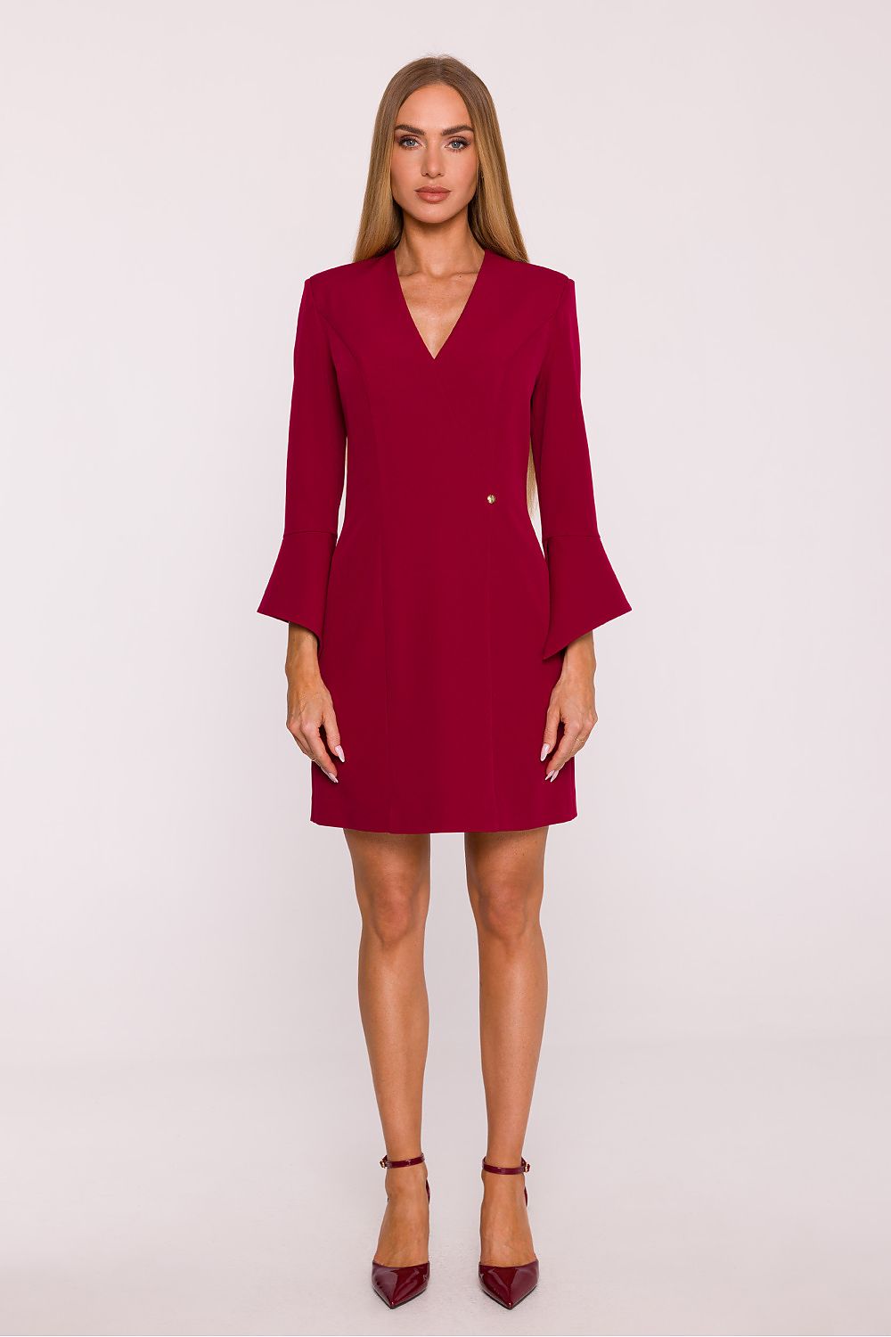 Woman wearing a red dress against a white background