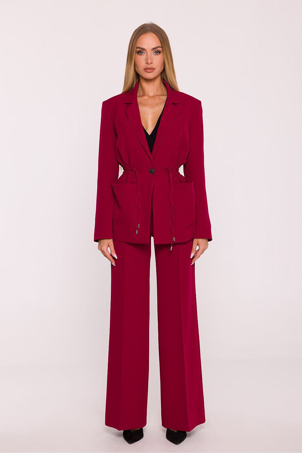Woman wearing a red suit on a white background