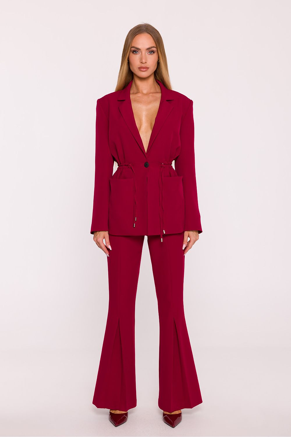 Woman wearing a red suit on a white background