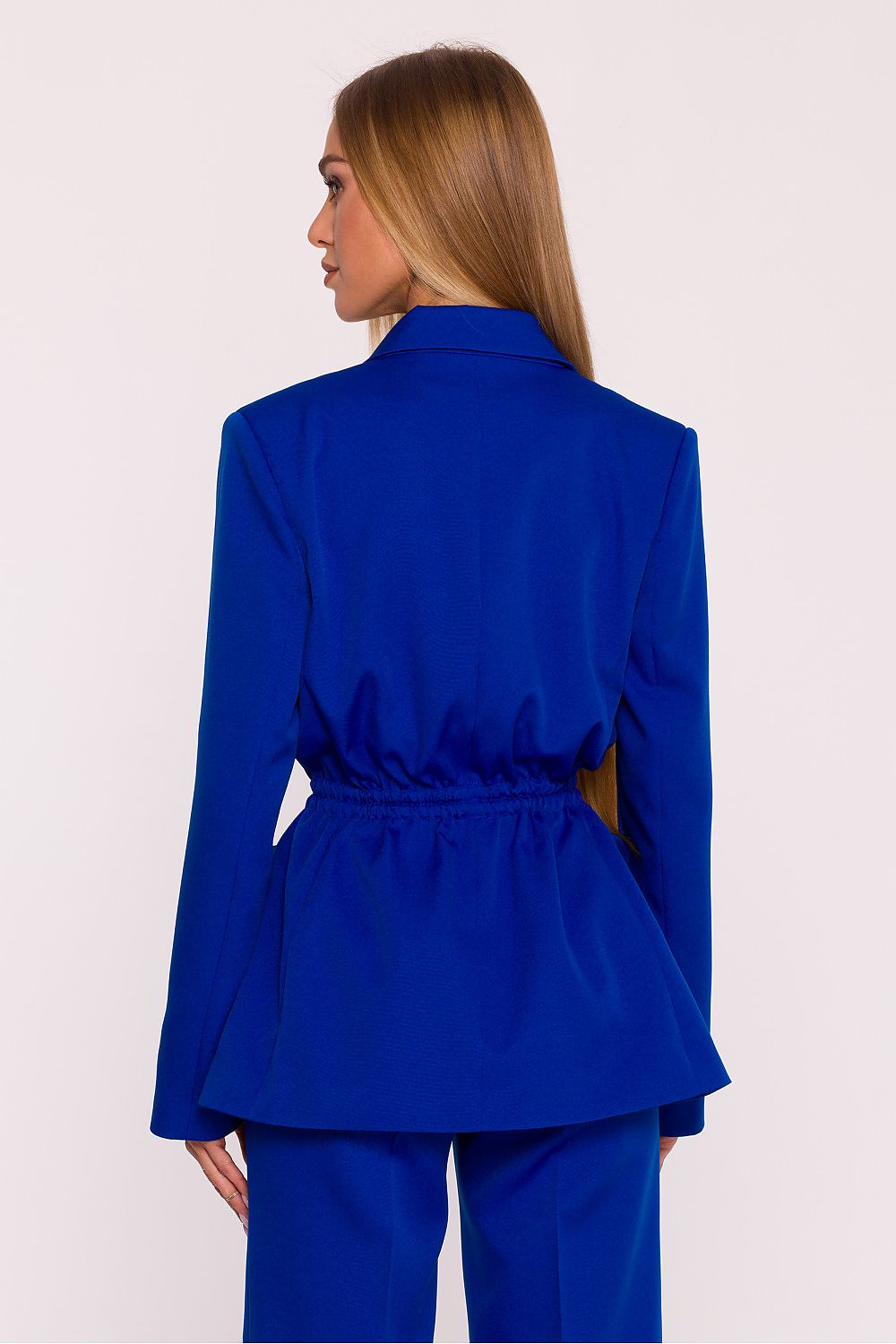 Woman wearing a blue suit on a white background